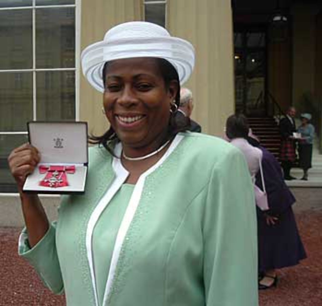 Nadine George receives her MBE at Buckingham palace