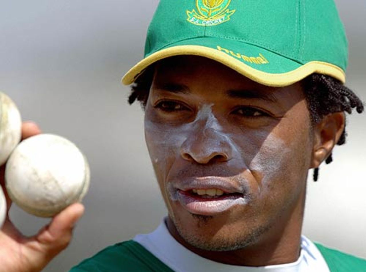 Makhaya Ntini inspects his weapon of choiceduring a practice match in Hyderabad, Hyderabad, November 14, 2005