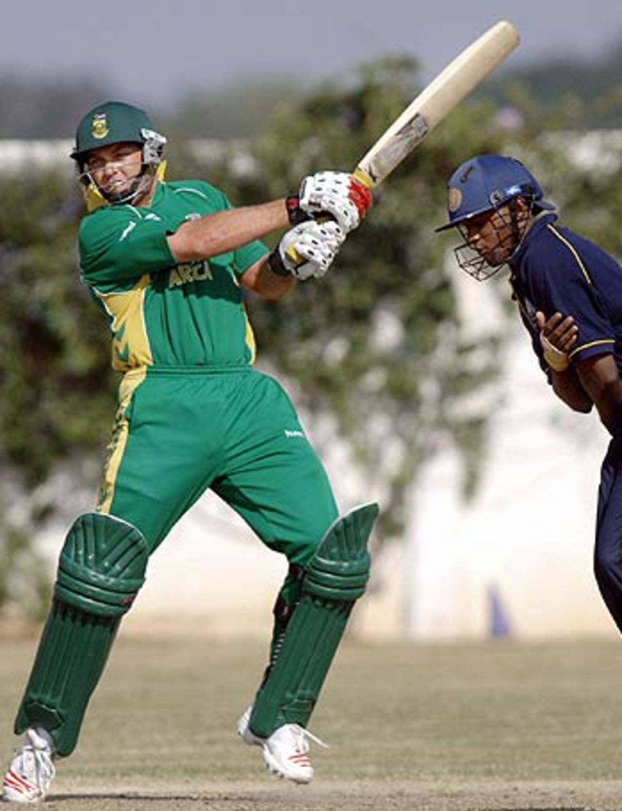 Jacques Kallis cracks one as a fielder looks on during a practice match in Hyderabad, Hyderabad, November 14, 2005