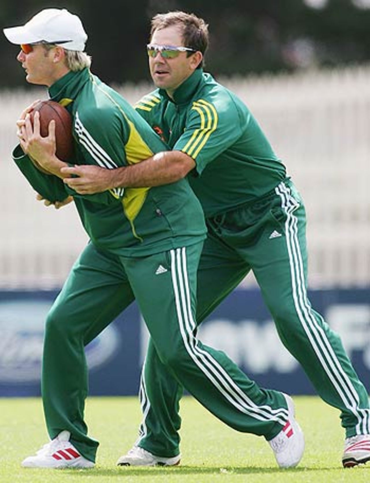 Michael Clarke is tackled by Ricky Ponting in a game of touch football during training, Bellerive Oval, Hobart, November 15, 2005