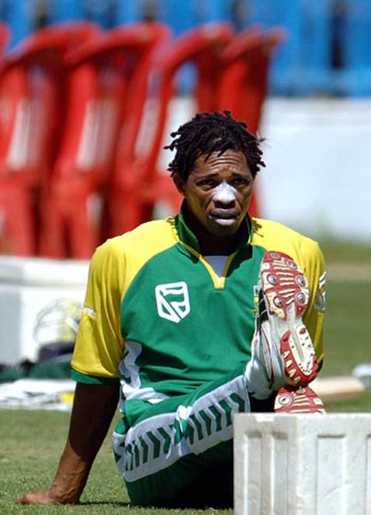 Makhaya Ntini does some stretching in a practice session ahead of the second ODI against India, Bangalore, November 18, 2005