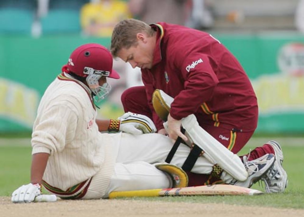 Ramnaresh Sarwan receives treatment from the physio after taking a knock on his knee, Australia v West Indies, 2nd Test, Hobart, 3rd day, November 19, 2005