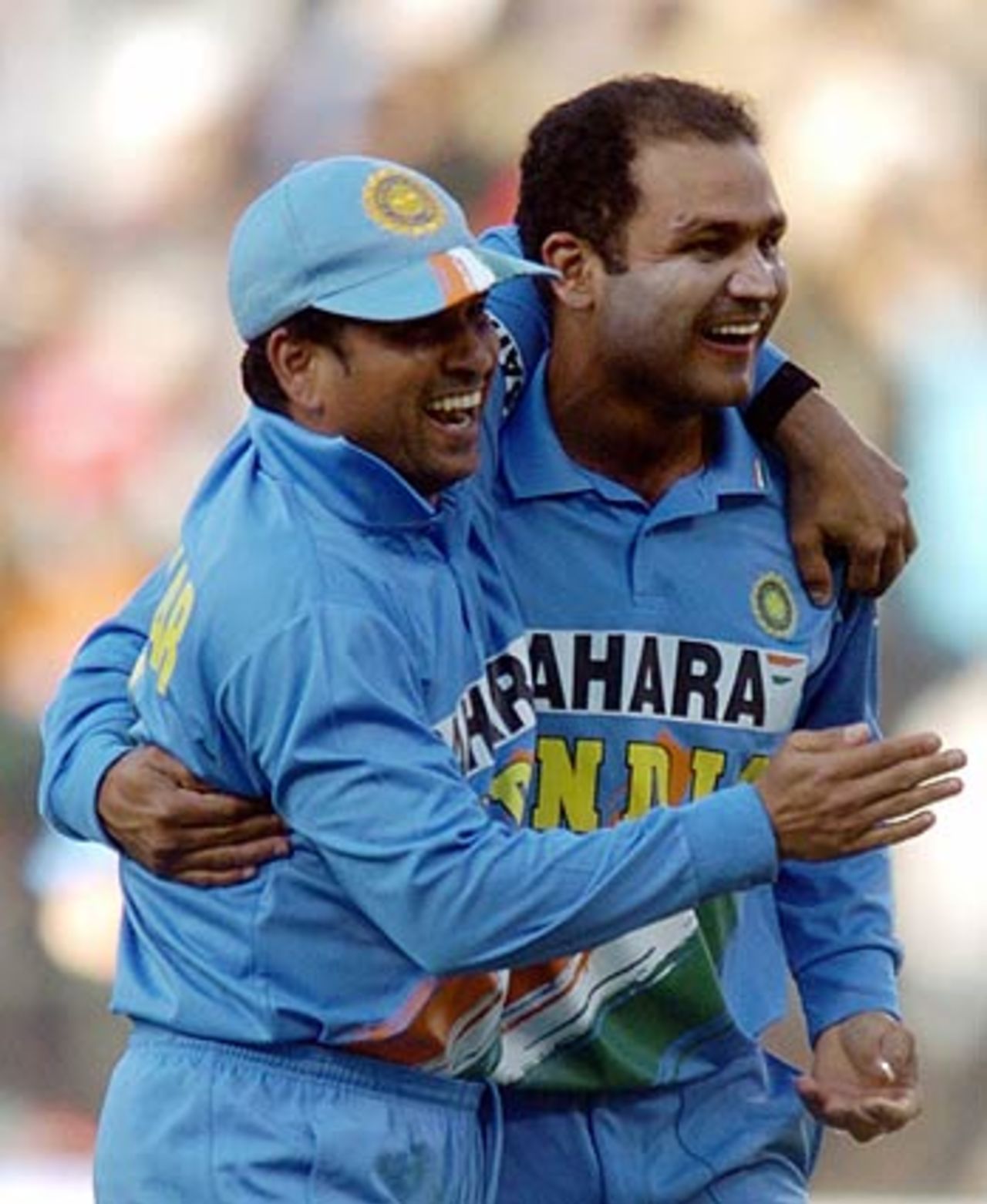 Sachin Tendulkar and Virender Sehwag celebrate another wicket, India v South Africa, 2nd ODI, Bangalore, November 19, 2005