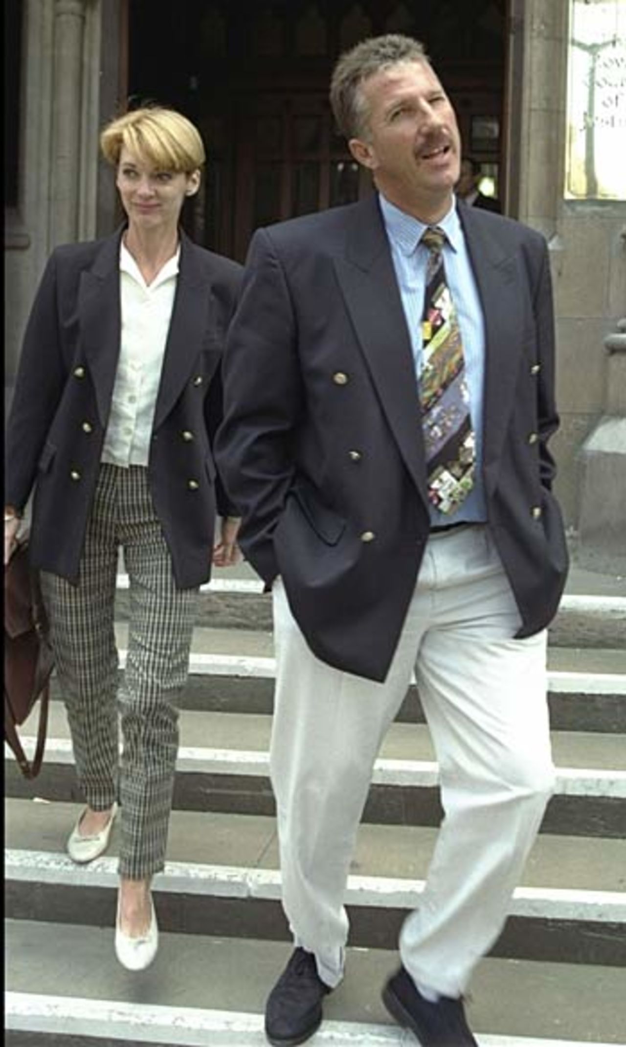 Ian Botham and his wife leave court during the Imran Khan libel case, London, July 16, 1996