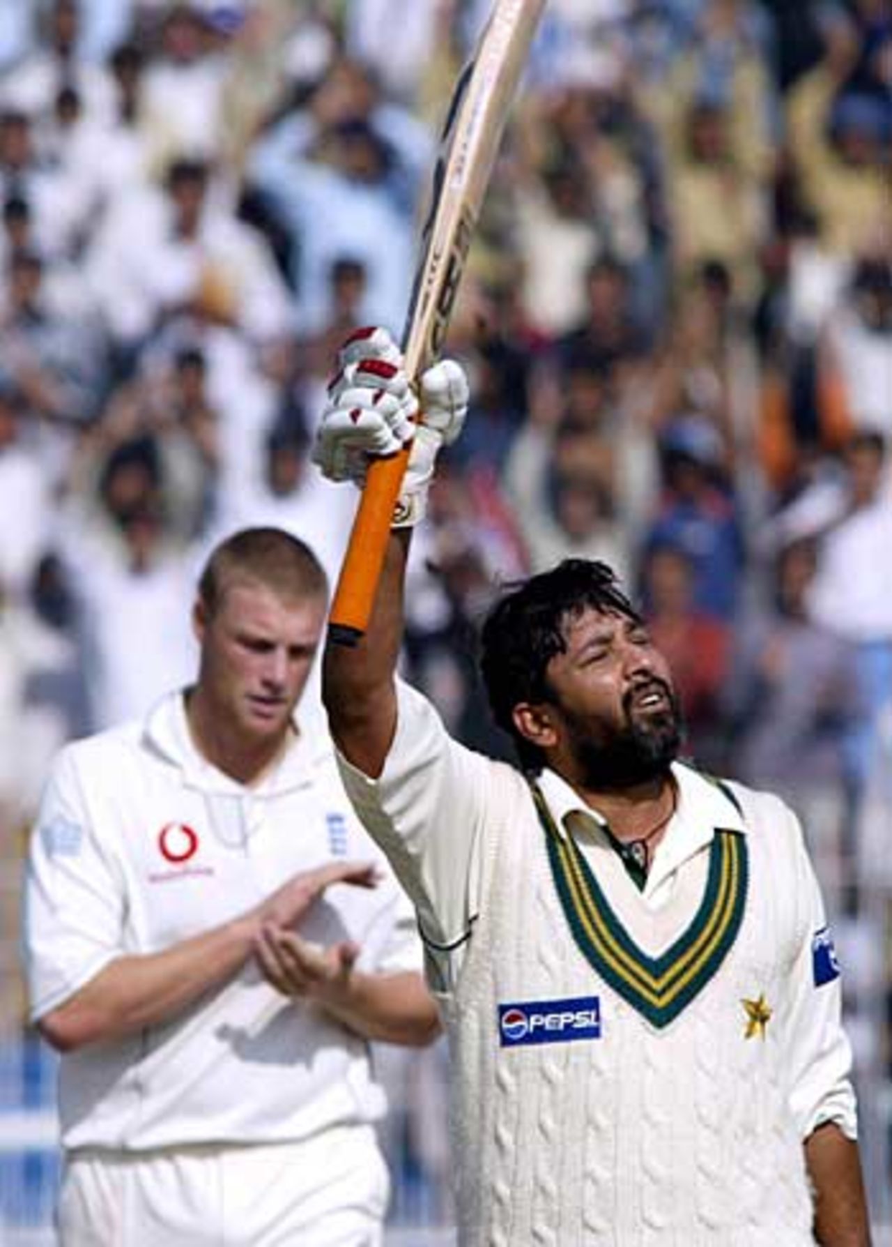 Inzamam-ul-Haq celebrates his second hundred of the match, applauded by Andrew Flintoff, Pakistan v England, 2nd Test, Faisalabad, November 24, 2005