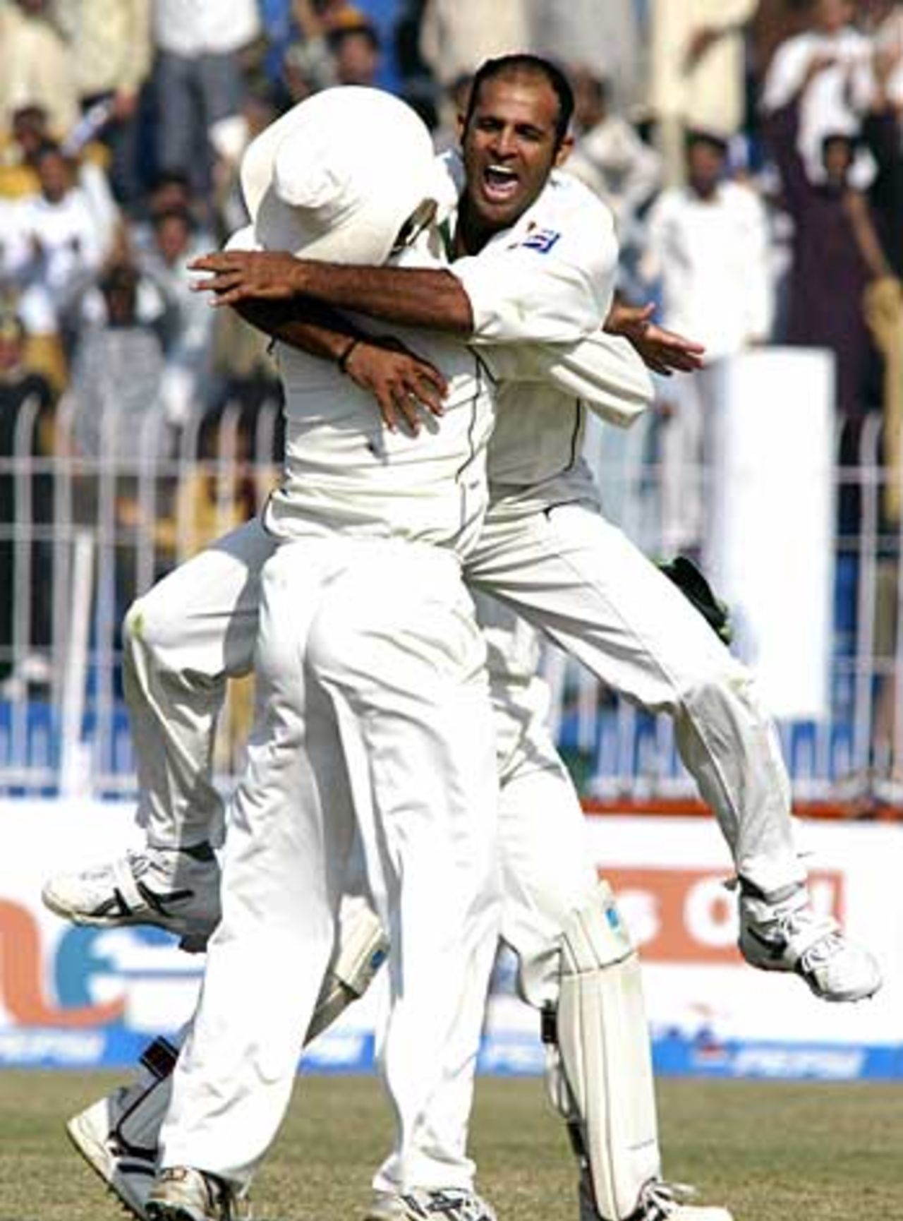 Joy for Rana Naved-ul-Hasan who celebrates Andrew Strauss's dismissal, Pakistan v England, 2nd Test, Faisalabad, November 24, 2005