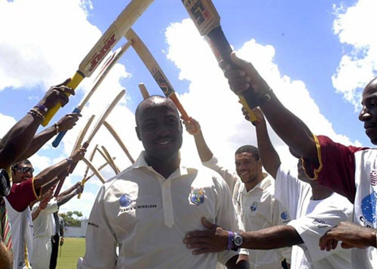 Brian Lara pulls receives a guard of honour from his team-mates after scoring 400, West Indies v England, Antigua, April 10, 2004