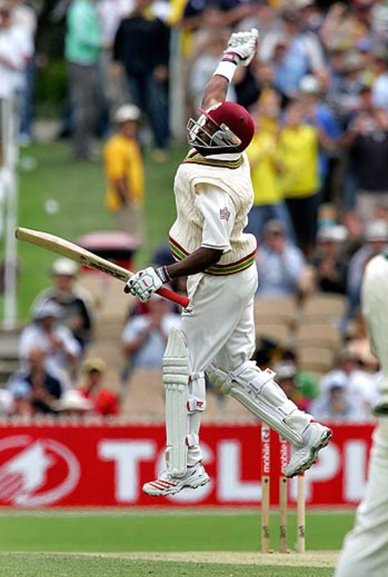 Brian Lara leaps with joy after going past Allan Border's record of 11,174 Test runs, Australia v West Indies, 3rd Test, Adelaide, 2nd day, November 26, 2005
