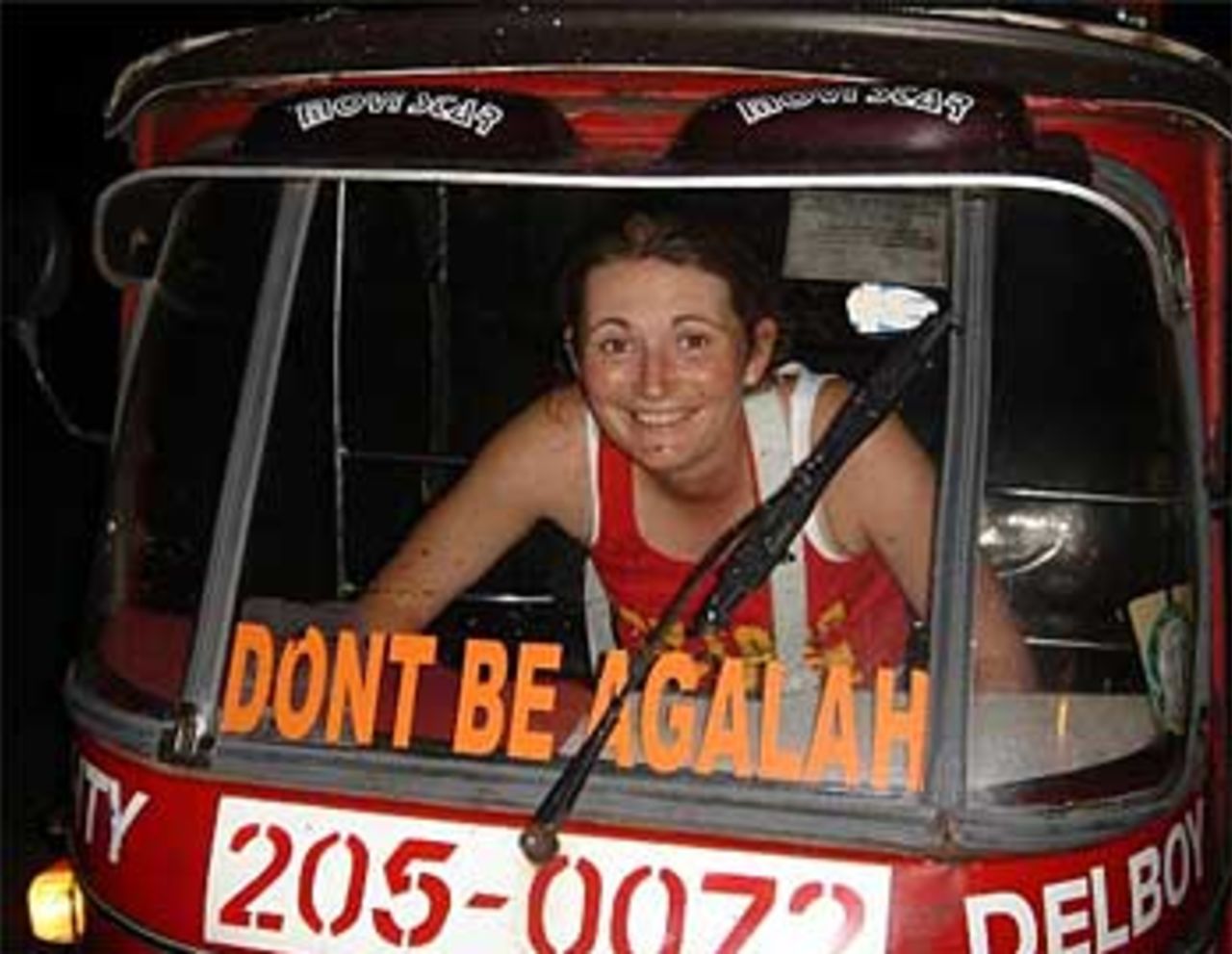 Charlotte Edwards practises driving a tuk-tuk during England's tour of India, November 27, 2005
