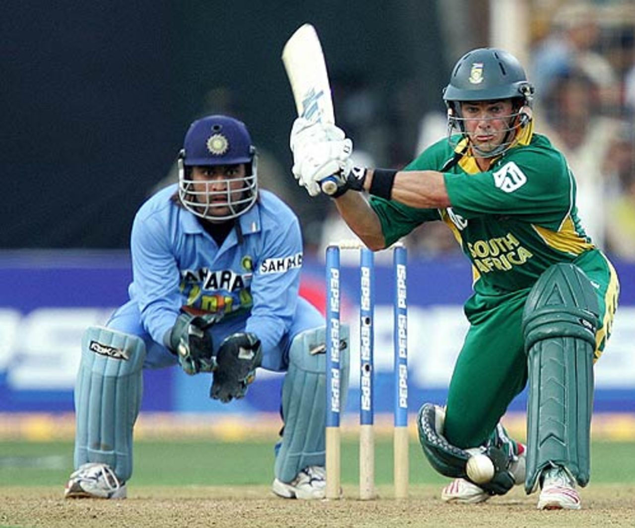 Mark Boucher prepares to sweep as Mahendra Singh Dhoni looks on, India v South Africa, 5th ODI, Mumbai, November 25, 2005