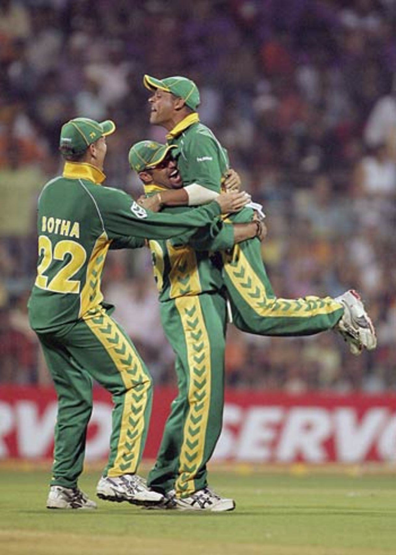 Ashwell Prince celebrates with Andrew Hall and Johan Botha after taking a spectacular catch to dismiss Sachin Tendu, India v South Africa, 5th ODI, Mumbai, November 25, 2005