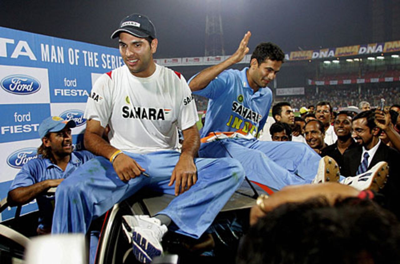 Yuvraj Singh on top of the car he won for being named Player of the Series,  along with Irfan Pathan , India v South Africa, 5th ODI, Mumbai, November 28, 2005