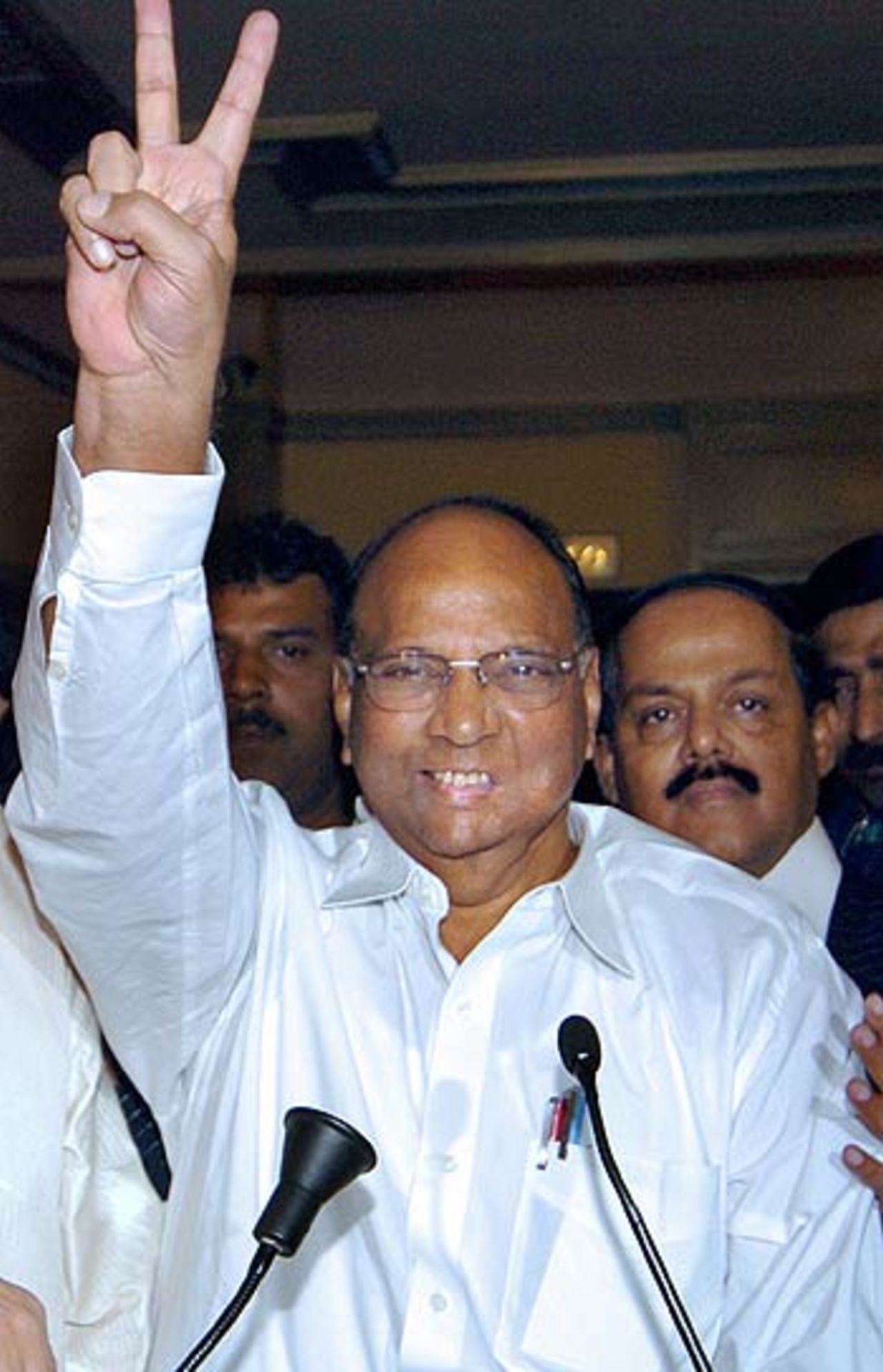 Indian Union Minister Sharad Pawar flashes a victory sign after he was elected as president of the Indian board, November 29, 2005