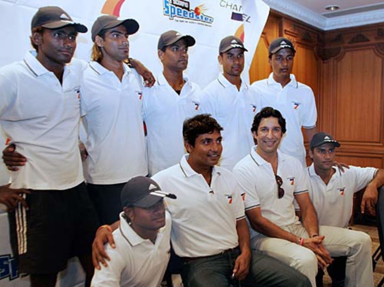 Wasim Akram and Ajay Jadeja pose with seven contestants at the announcement of India's first reality cricket TV series "Scorpio Speedster 2005" in Mumbai, November 29, 2005