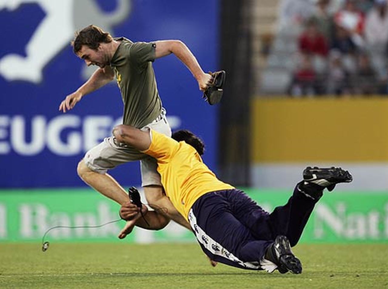 Trying out for the All Blacks - a security guard brings down a pitch invader, New Zealand v Australia, 1st ODI, Chappell-Hadlee Trophy, Auckland, December 3, 2005