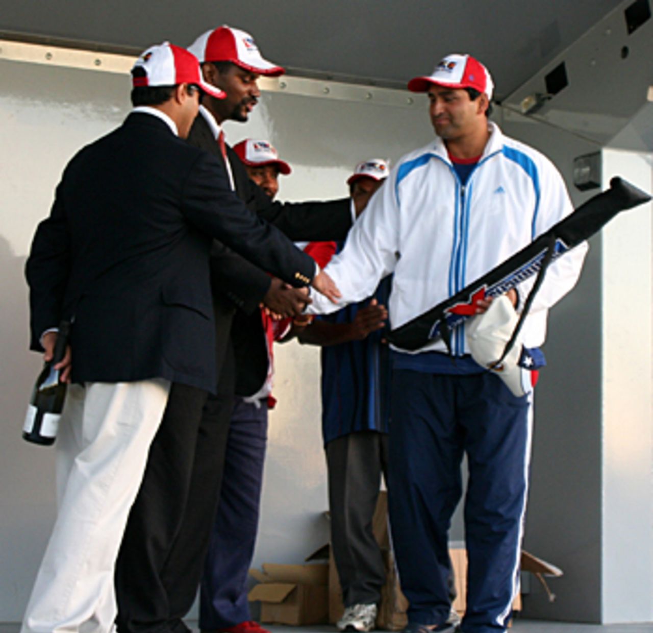 Sushil Nadkarni receives his Most Valuable Player award from Bernard Cameron, National Interstate Cricket Tournament Champion's Trophy, Florida, December 4, 2005