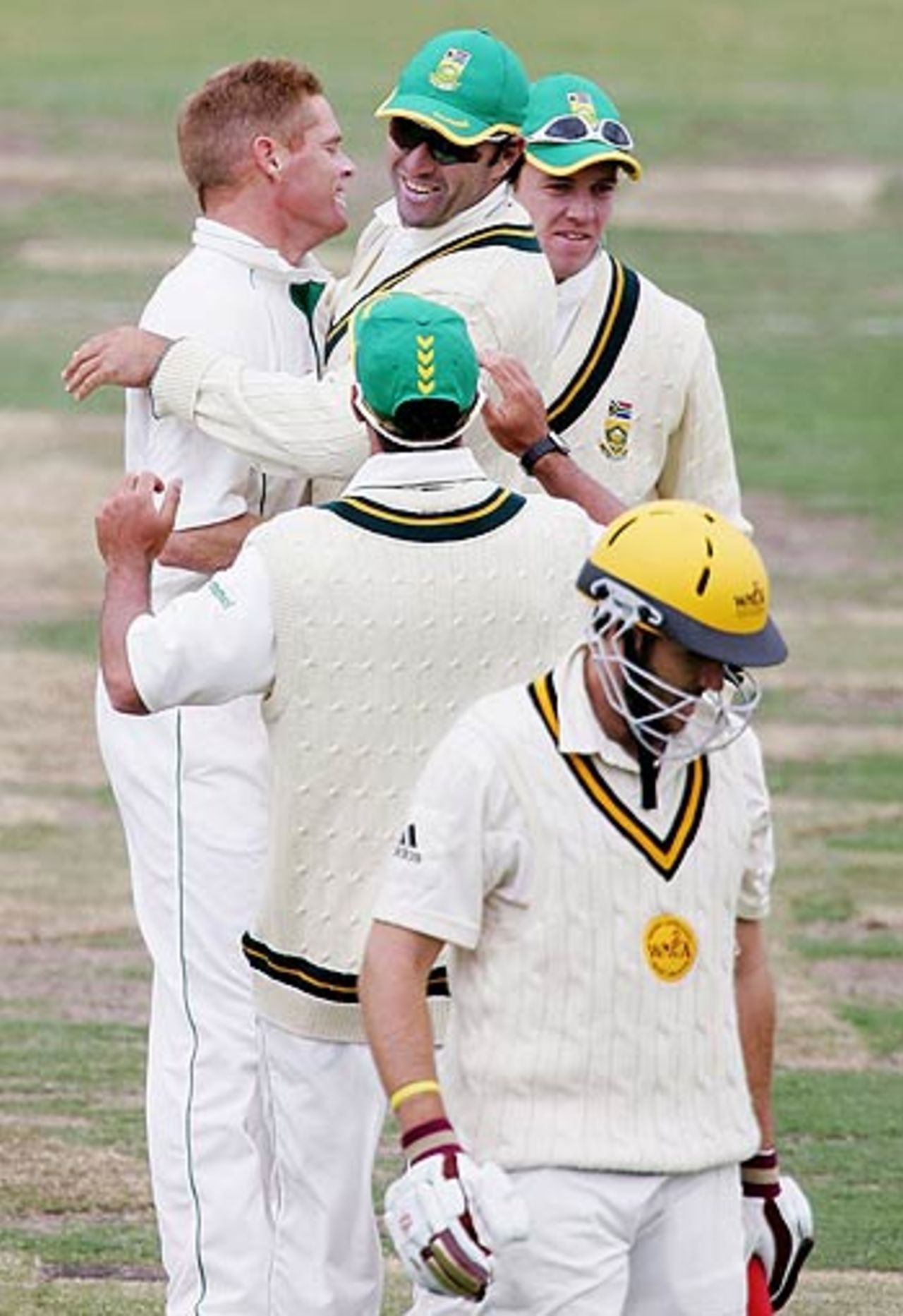 Shaun Pollock is congratulated by Justin Kemp after dismissing Clint Heron , Western Australia v South Africa, WACA, Perth, December 5, 2005