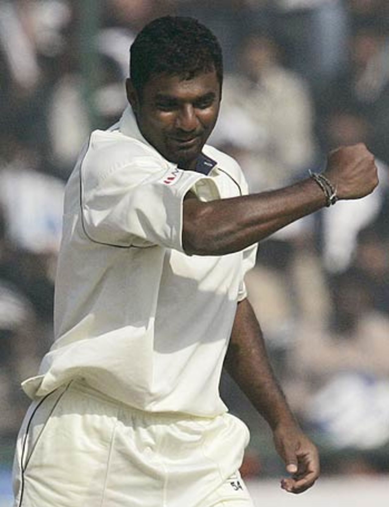 Muttiah Muralitharan spun a web around India in the first session on day two, India v Sri Lanka, Delhi, December 11, 2005