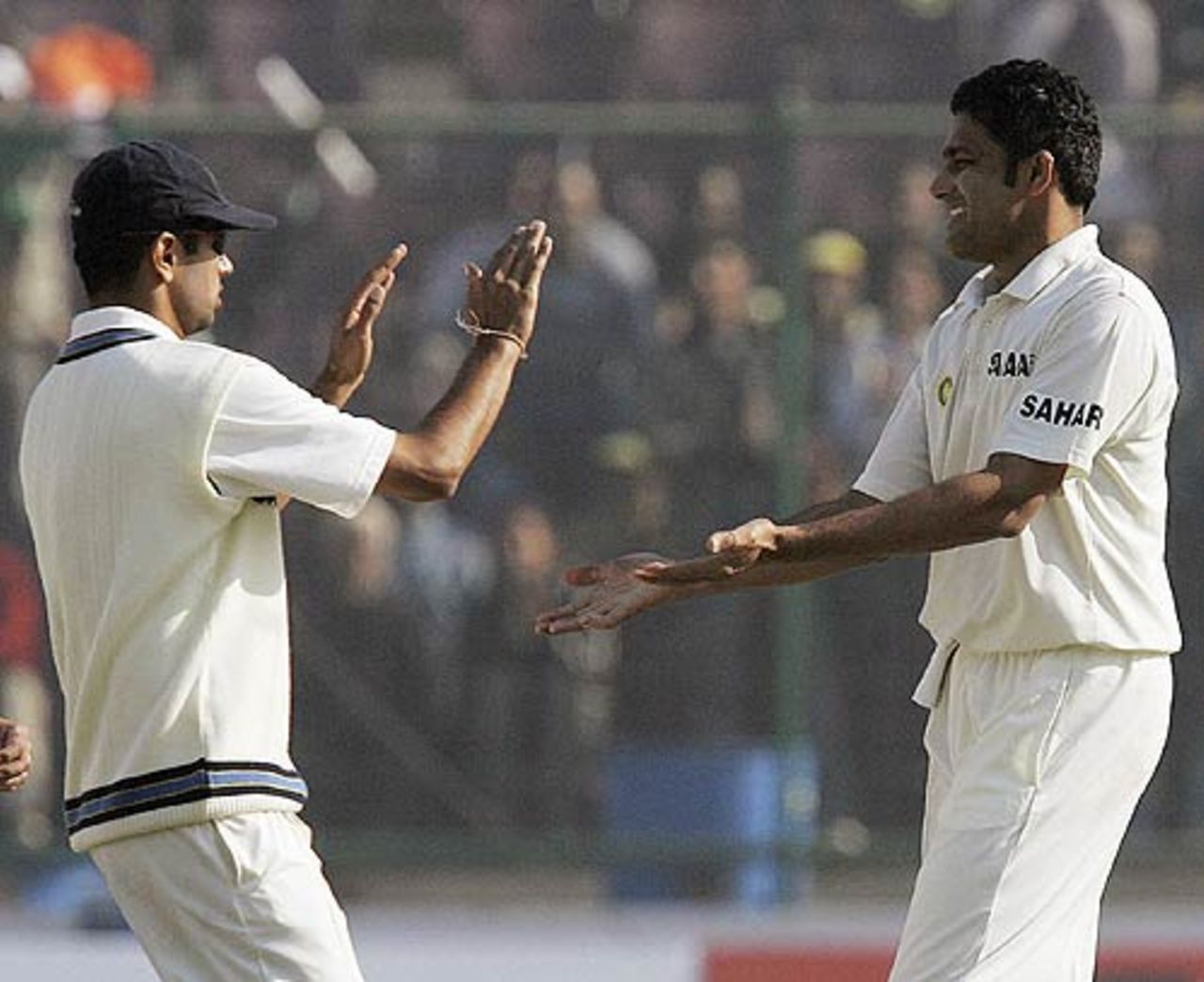 Rahul Dravid congratulates Anil Kumble on another strike, India v Sri Lanka, 2nd Test, Delhi, 2nd day, December 12, 2005