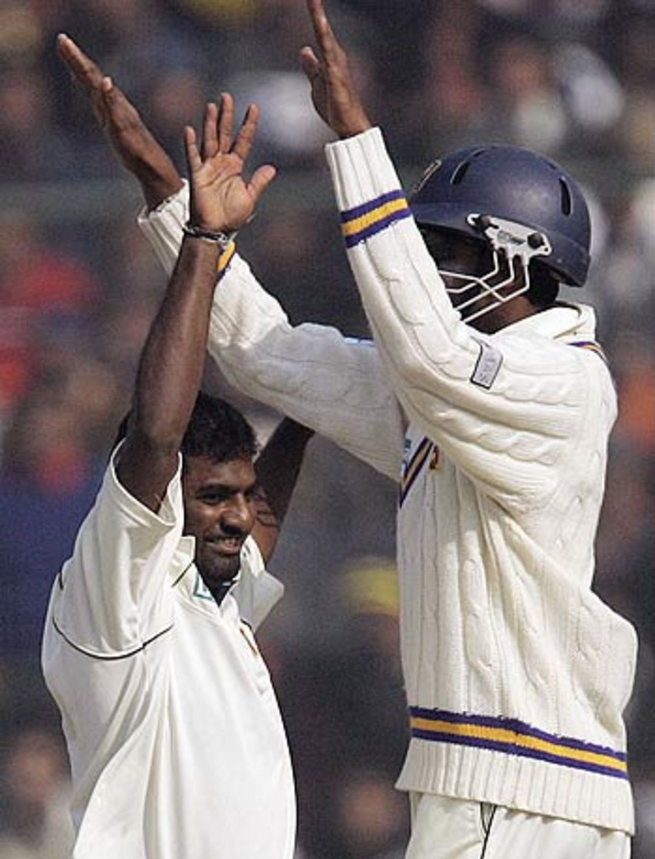Muttiah Muralitharan and Jehan Mubarak celebrate the dismissal of Sourav Ganguly, India v Sri Lanka, 2nd Test, Delhi, 3rd day, December 13, 2005