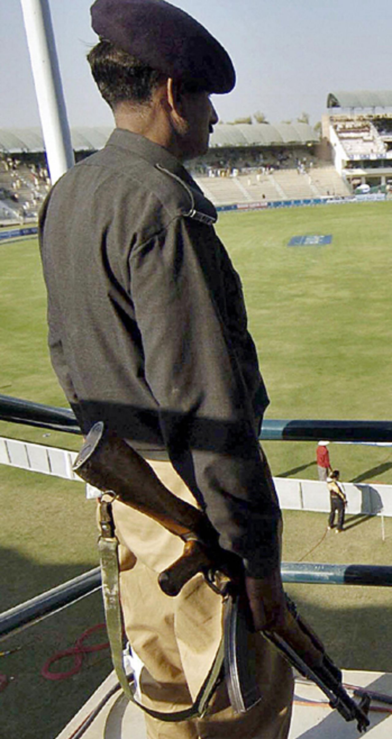 A Pakistani policeman stands guard as England practise, Multan, November 17, 2005