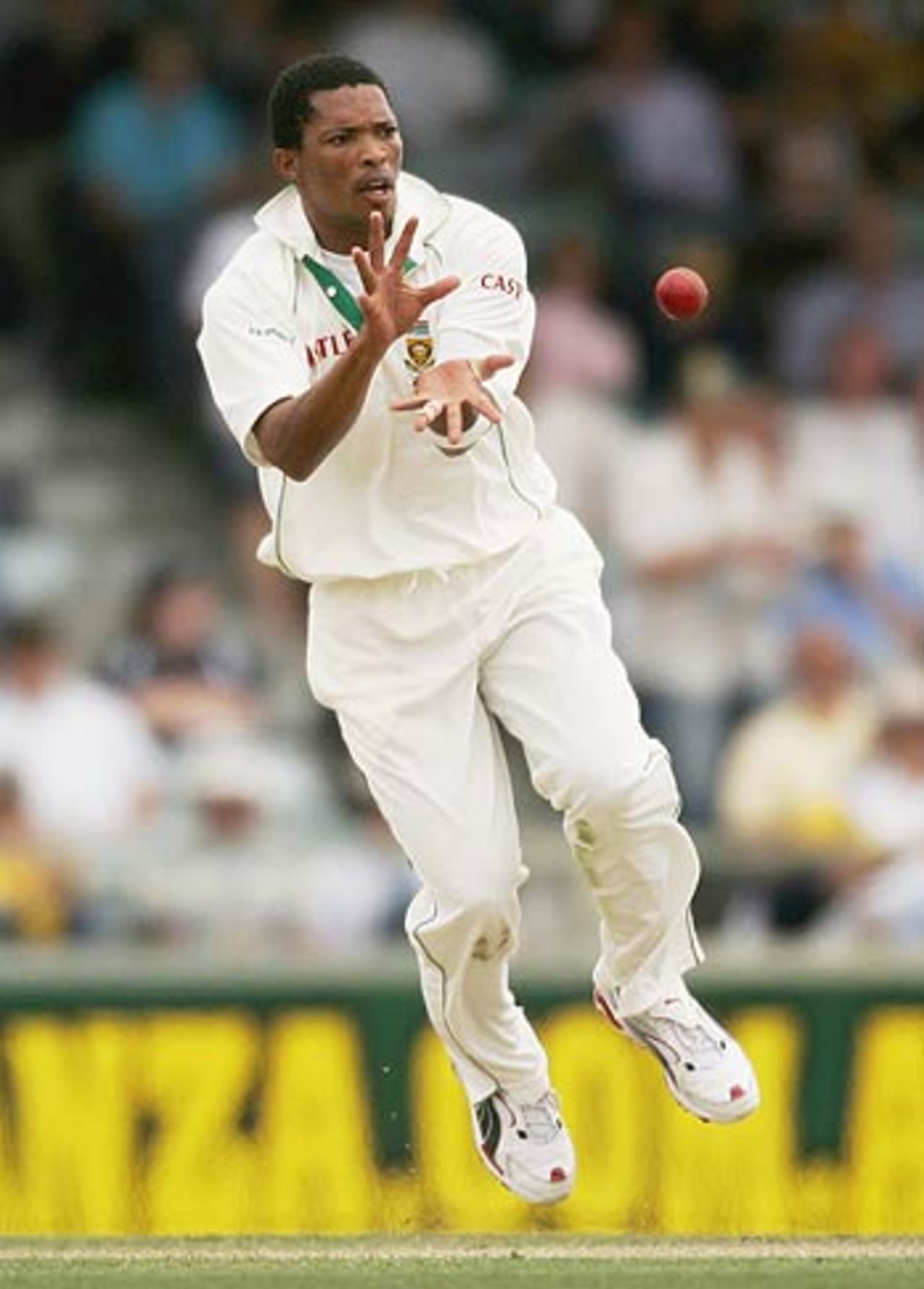 Makhaya Ntini fields off his own bowling, Australia v South Africa, 1st Test, Perth, 1st day, December 16, 2005