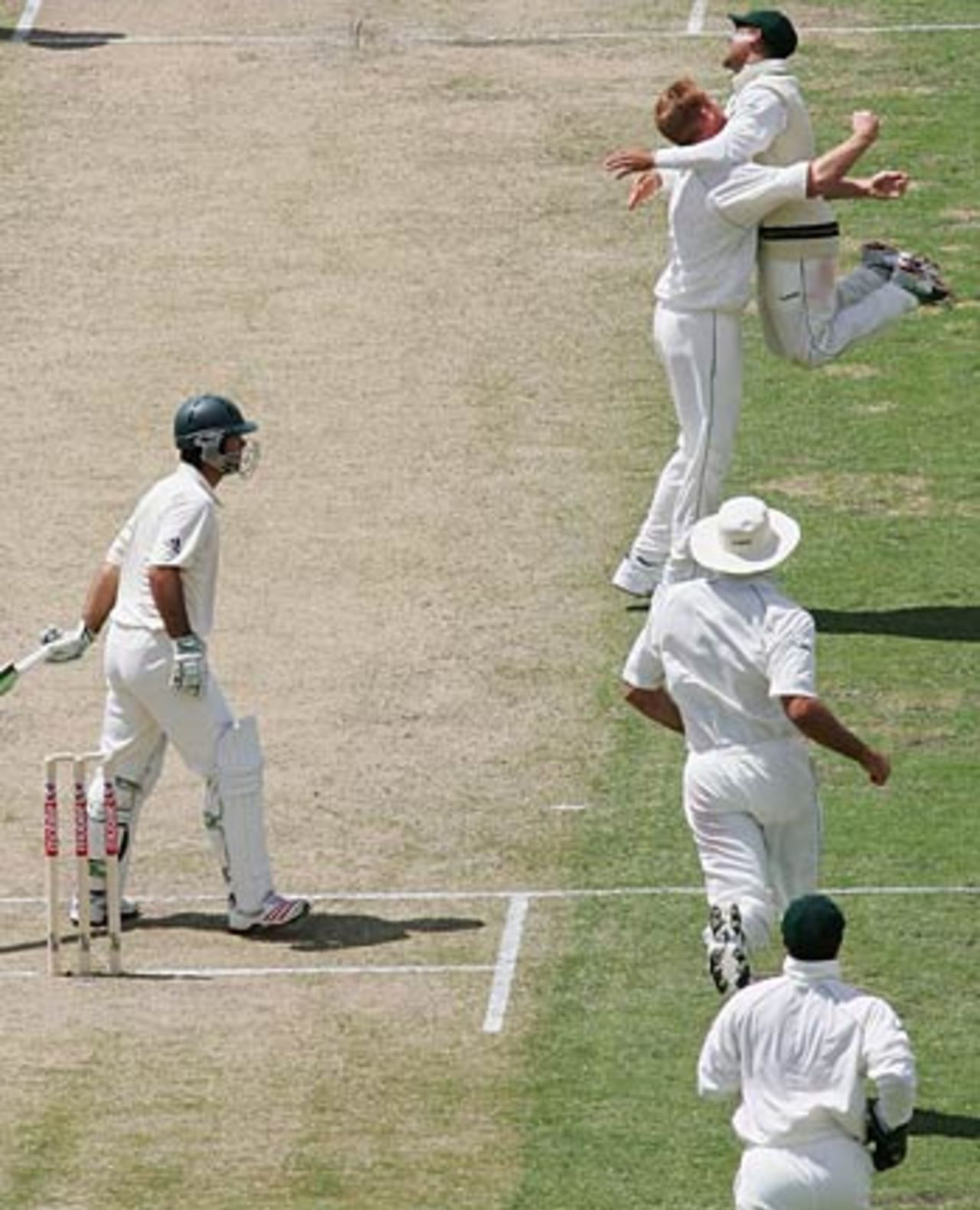 The South Africans rush towards Shaun Pollock after Ricky Ponting falls, Australia v South Africa, 1st Test, Perth, 1st day, December 16, 2005