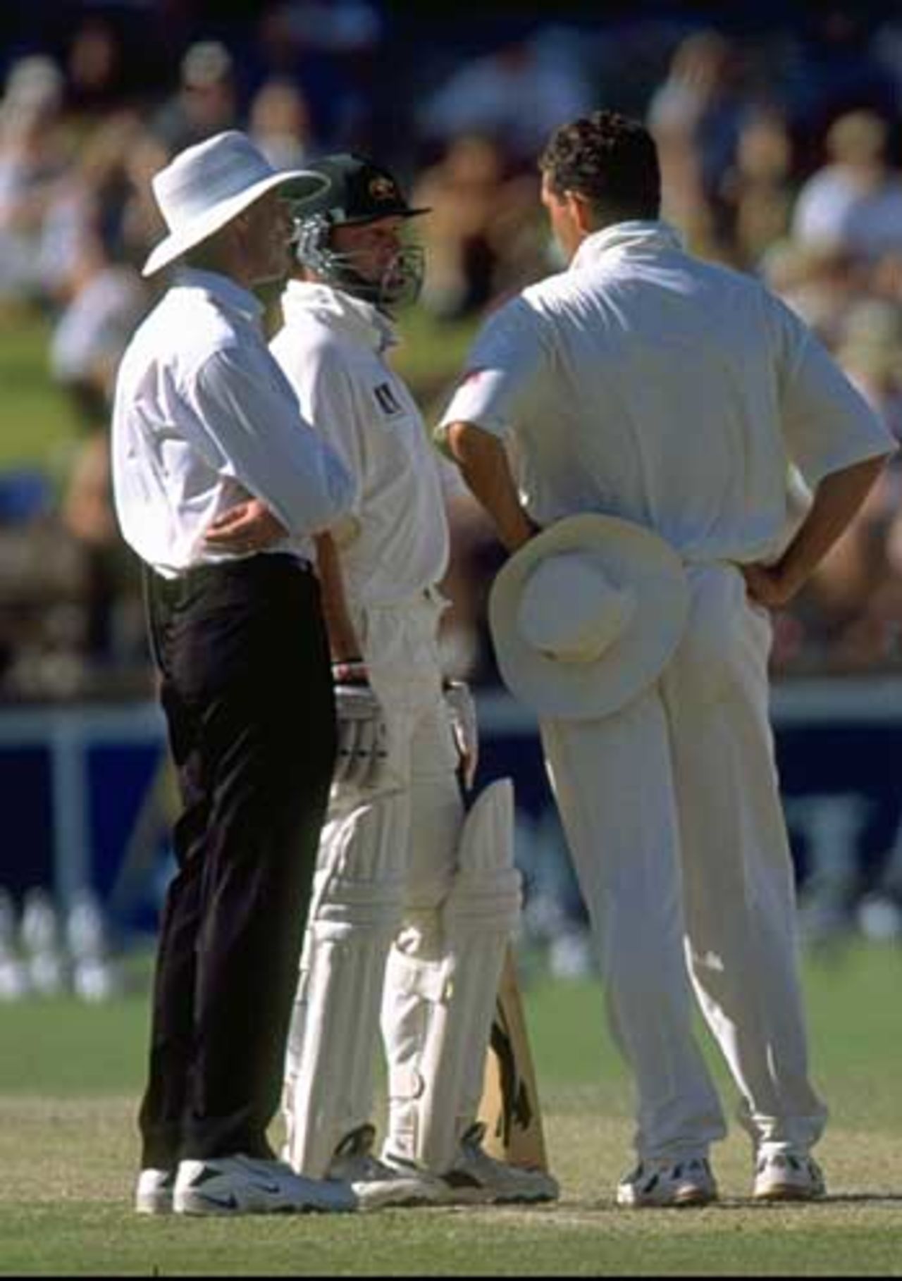 A bouncer from Shaun Pollock caused Mark Waugh to clip the stumps, dislodging the bails, but was given not-out. Hansie Cronje discusses the incident with Waugh and the umpire, Australia v South Africa, 3rd Test, Adelaide, Jan 30 - Feb 3, 1998