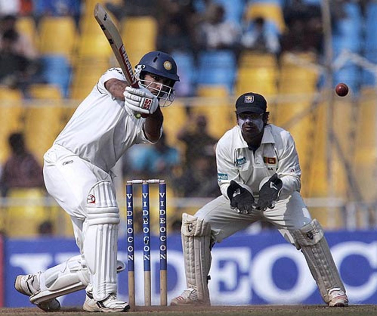 Yuvraj Singh drives as Kumar Sangakkara looks on, India v Sri Lanka, 3rd Test, Ahmedabad, December 20, 2005