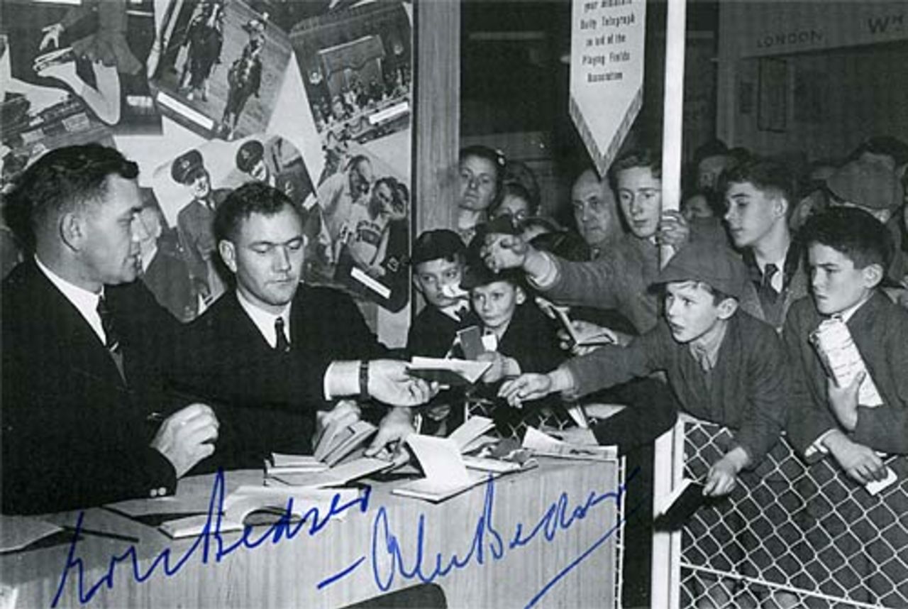 Alec and Eric Bedser signs autographs for children, 1948