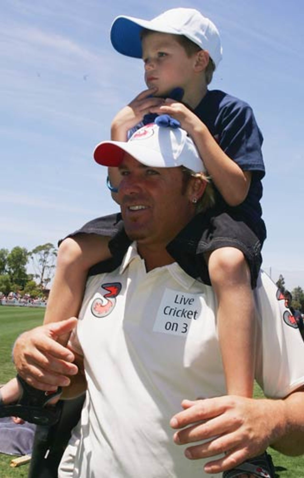 Shane Warne and his son during the six-a-side match between an Australia XI and the Essendon AFL Team, Windy Hill, Melbourne, December 22, 2005 