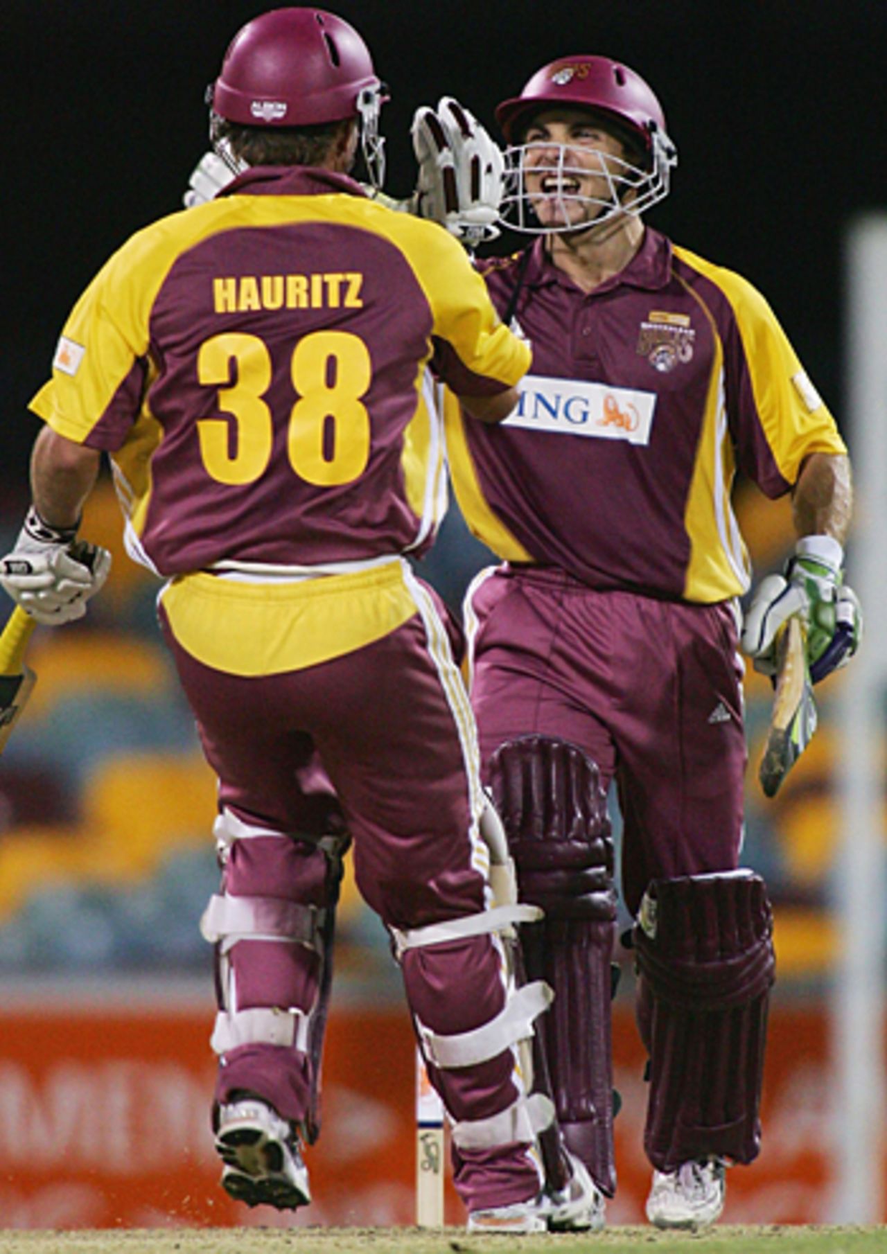 Chris Hartley and Nathan Hauritz celebrate victory, Queensland v Western Australia, ING Cup, Brisbane, December 22, 2005