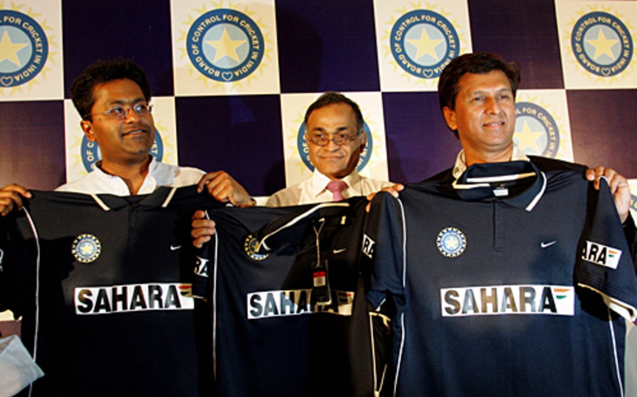 Indian board vice-president Lalit Modi, secretary Niranjan Shah(C) and chairman of selectors Kiran More pose for photographers as they unveil a new Indian cricket team outfit made by Nike, Mumbai, December 23, 2005