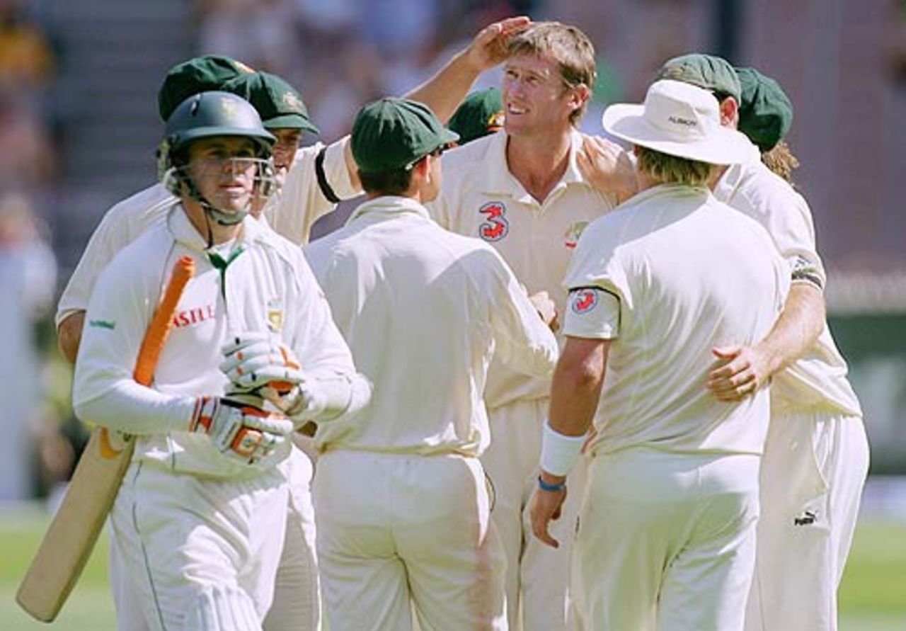 AB de Villiers walks back as Glenn McGrath is congratulated by his team-mates, 2nd Test, Melbourne, 2nd day, December 27, 2005