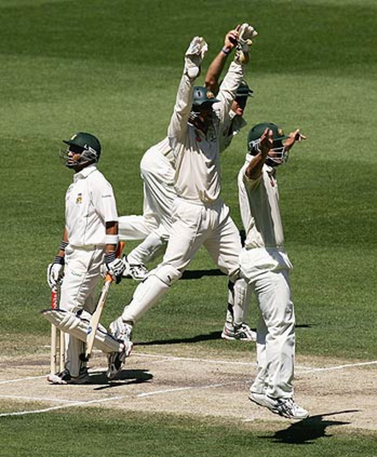 Australian fielders celebrate the wicket of Ashwell Prince, Australia v South Africa, 2nd Test, Melbourne, 4th day, December 30, 2005