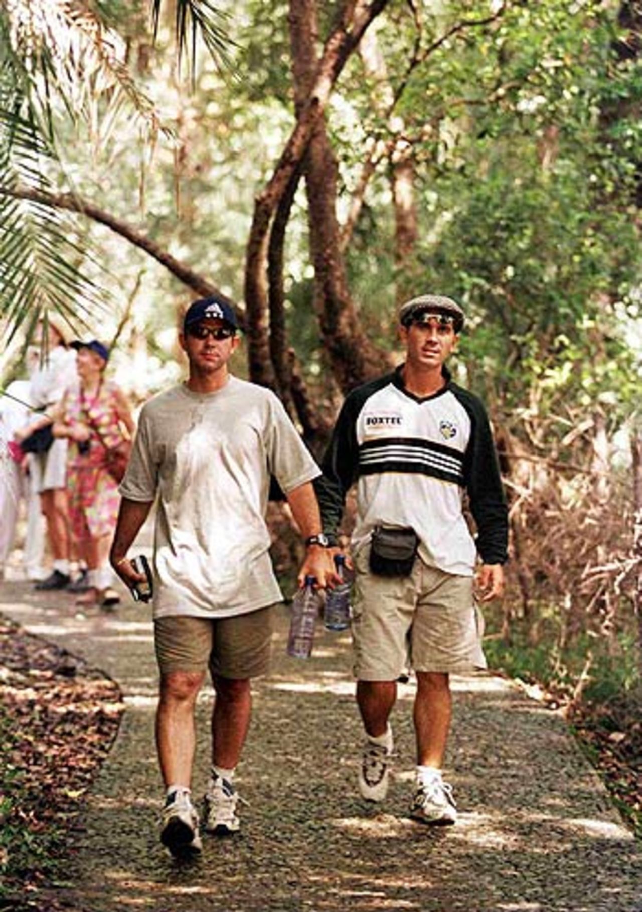 Ricky Ponting and Justin Langer of Australia walk through the rainforest to get to Victoria Falls during Australia's first tour to Zimbabwe, October 12, 1999