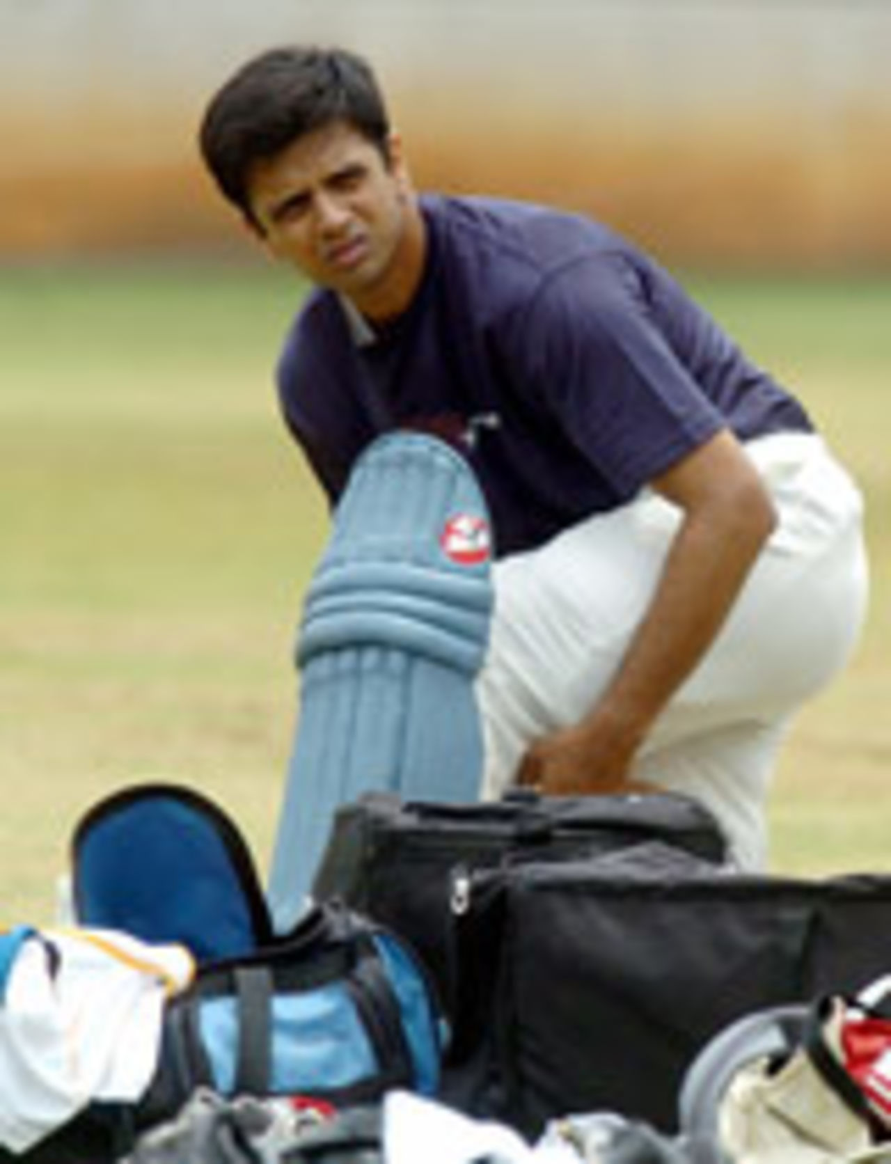 Rahul Dravid straps on his pads before a nets session in Bangalore