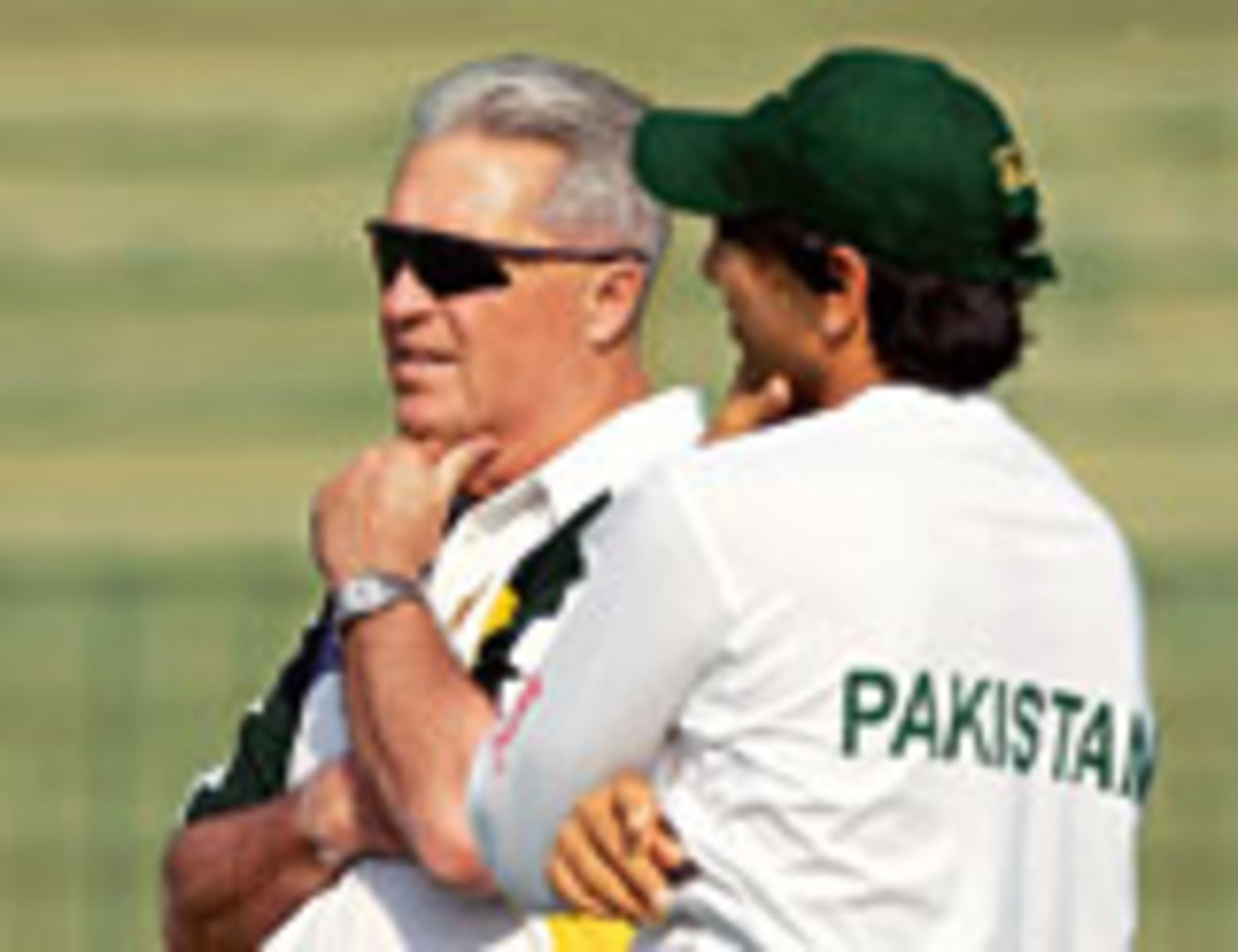 Pakistan coach Bob Woolmer confers with a player at a training session during England's tour in 2005-06