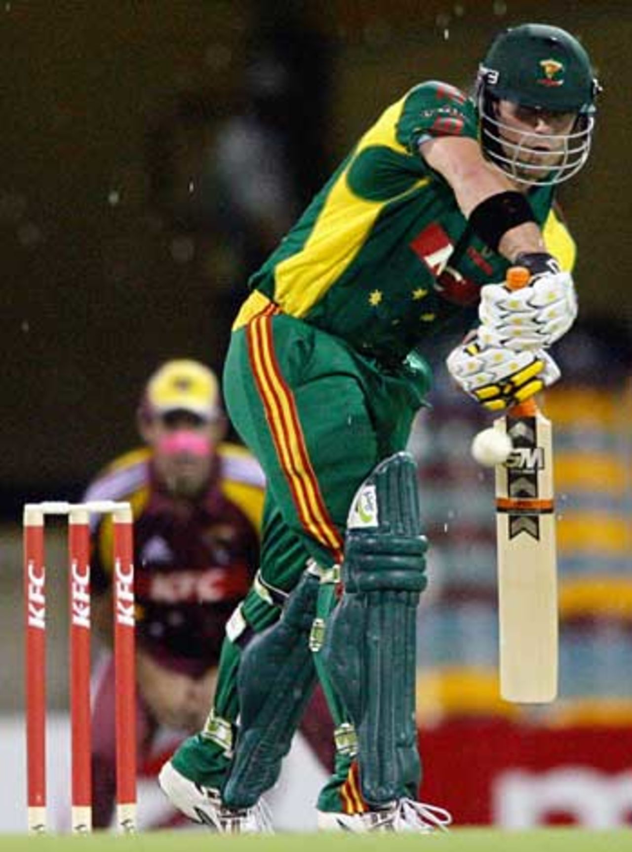 Travis Birt bats before the rain arrives to end the opening Twenty20 match, Queensland v Tasmania, Twenty20, Brisbane, January 6, 2006