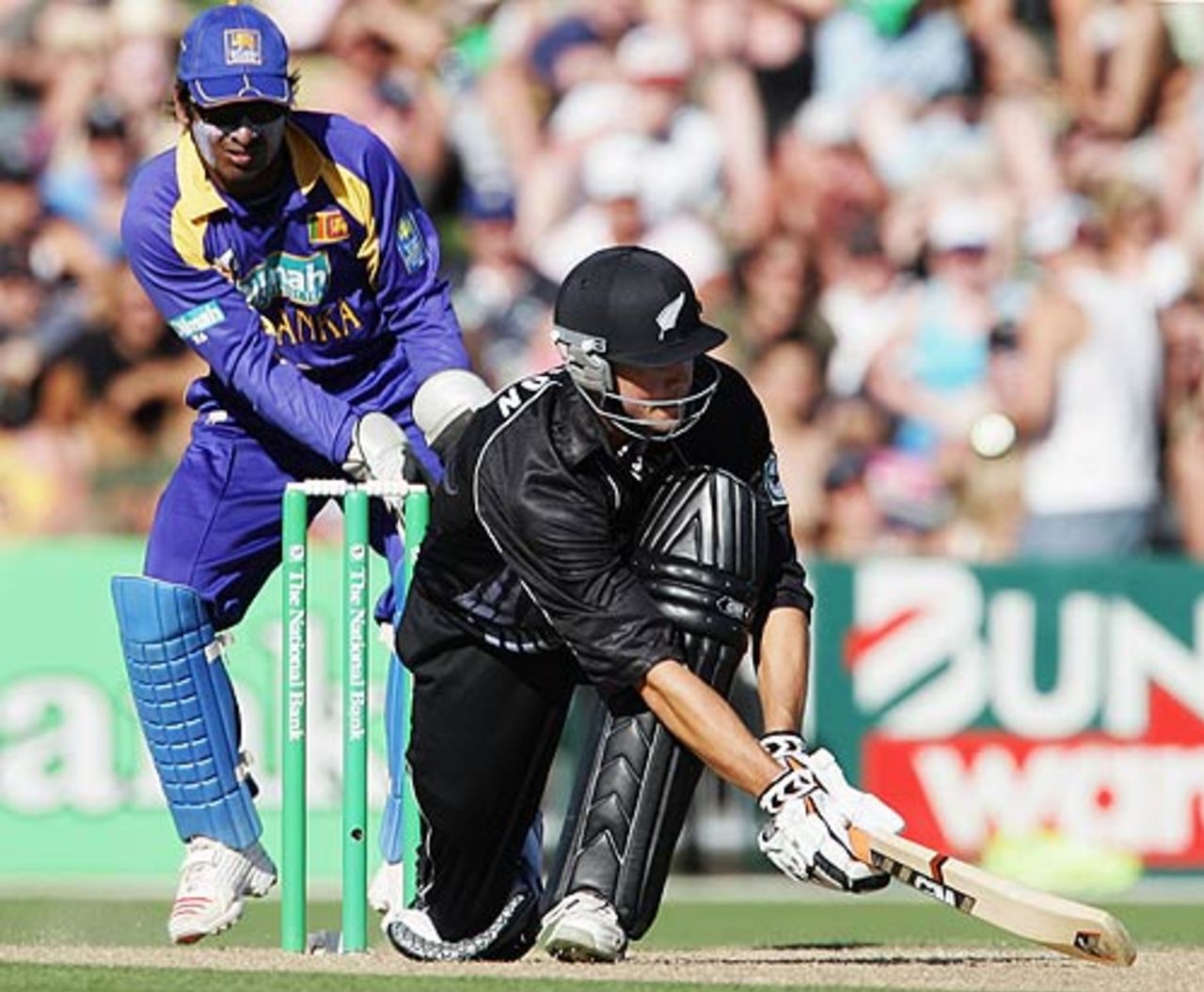 Kumar Sangakarra looks on as Peter Fulton sweeps his way past fifty, New Zealand v Sri Lanka, 5h ODI, Napier, January 8, 2006