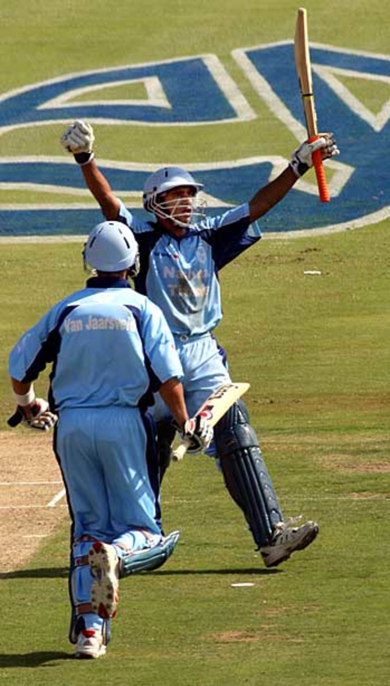 Goolam Bodi celebrates his hundred...and the victory over the Dolphins, 2nd Semi Final Standard Bank Cup, Centurion, January 8, 2005