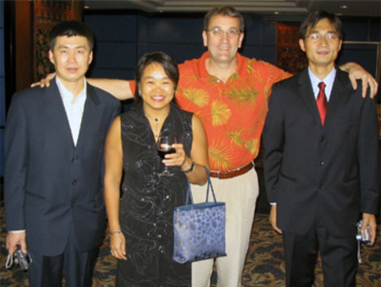 Rebecca Pan and Dr Hugh Tyrwhitt-Drake with Chinese course participants, Dr Liu Jing-min (far left) and Li Zhen (far right) at the ACC Umpiring Course in Malaysia