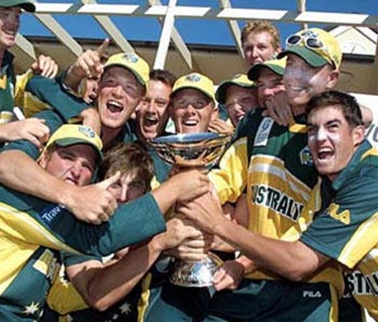 Australia Under-19 players celebrate with the ICC Under-19 World Cup trophy. ICC Under-19 World Cup Super League Final: Australia Under-19s v South Africa Under-19s at Bert Sutcliffe Oval, Lincoln, 9 February 2002.