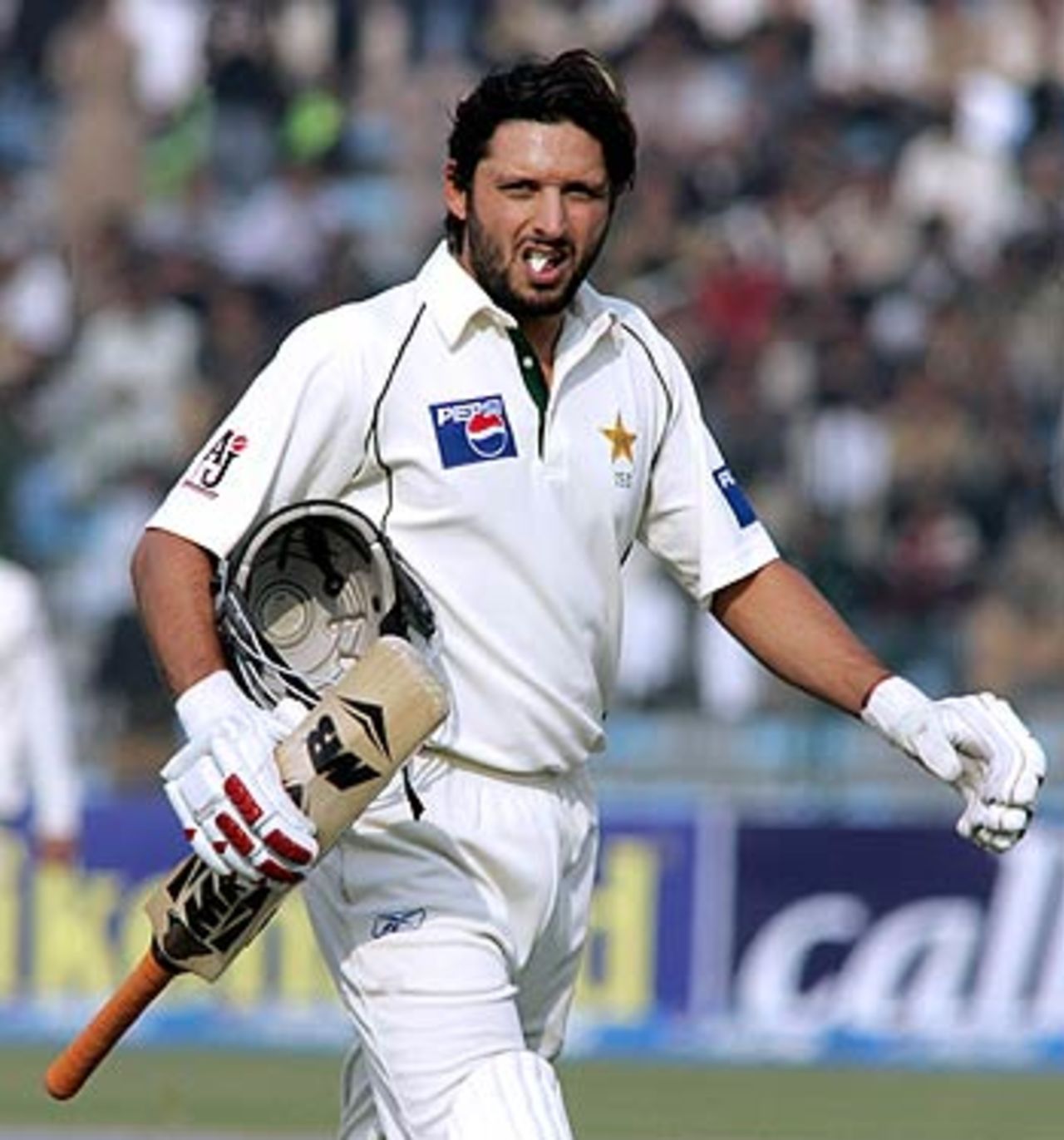 Cowboy up: Shahid Afridi strides back to the pavilion after a job well done, India v Pakistan, 1st Test, Lahore, 2nd day, January 14, 2006