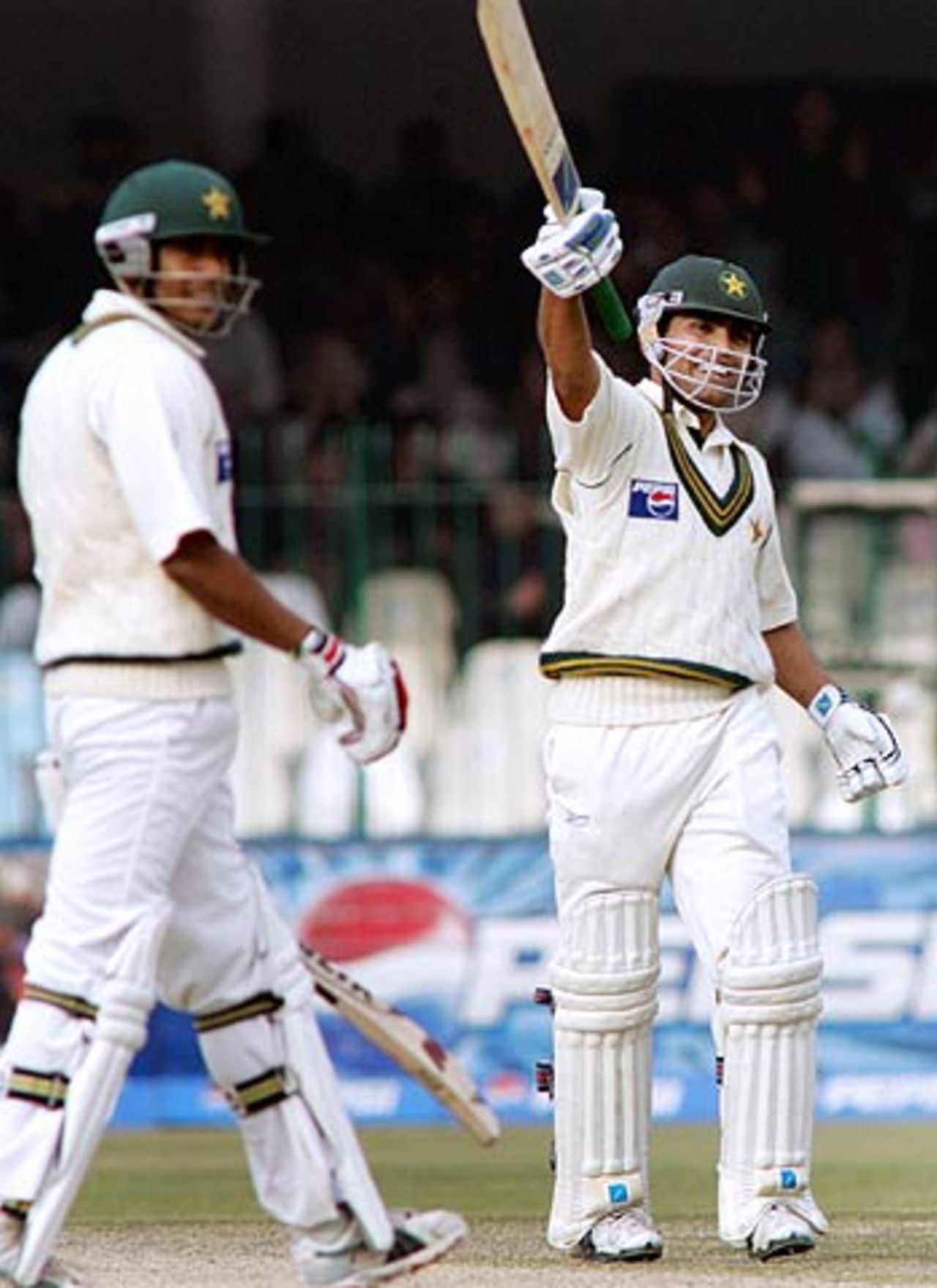 Smiles from Kamran Akmal after bringing up his own hundred, India v Pakistan, 1st Test, Lahore, 2nd day, January 14, 2006