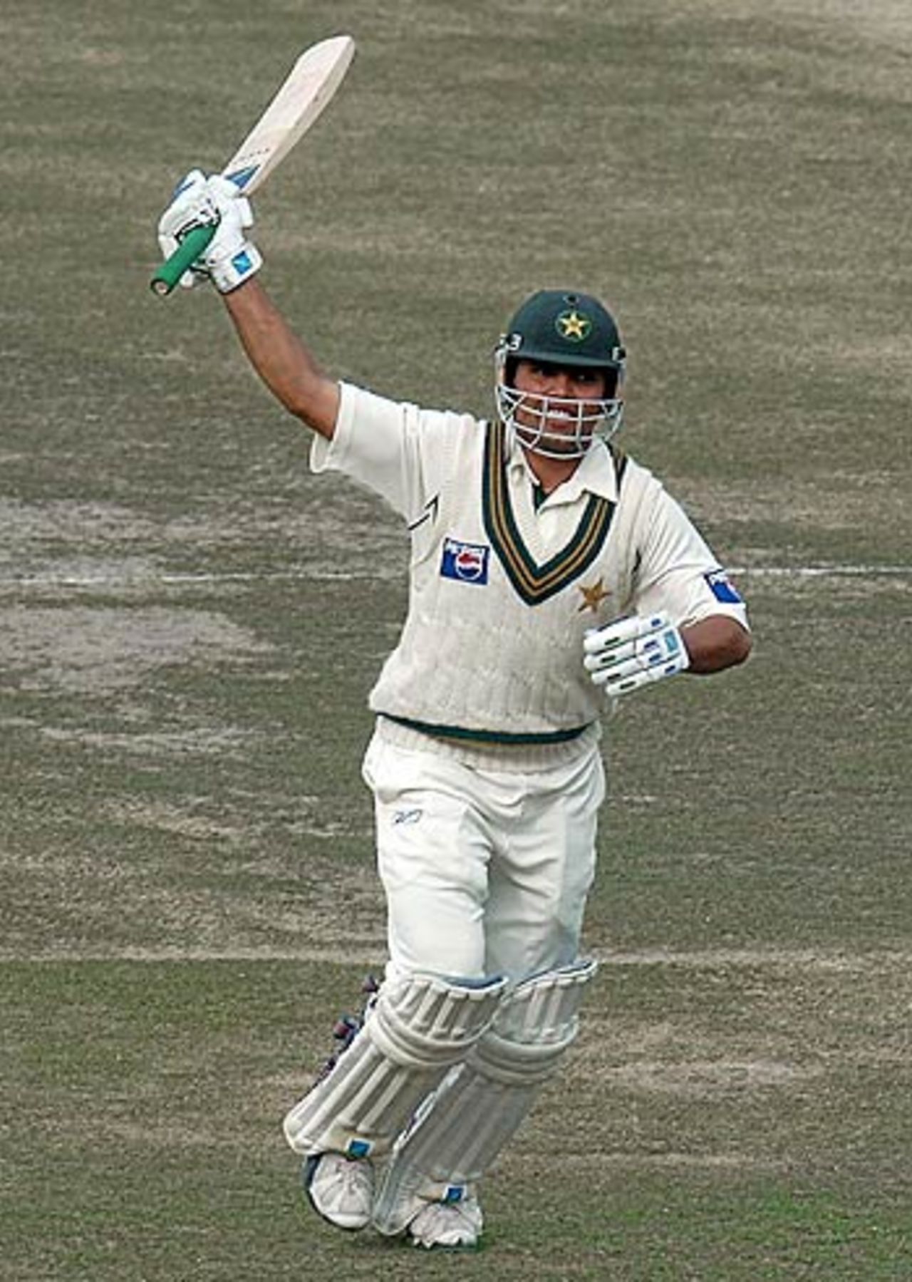 Kamran Akmal celebrates his third Test century, India v Pakistan, 1st Test, Lahore, 2nd day, January 14, 2006