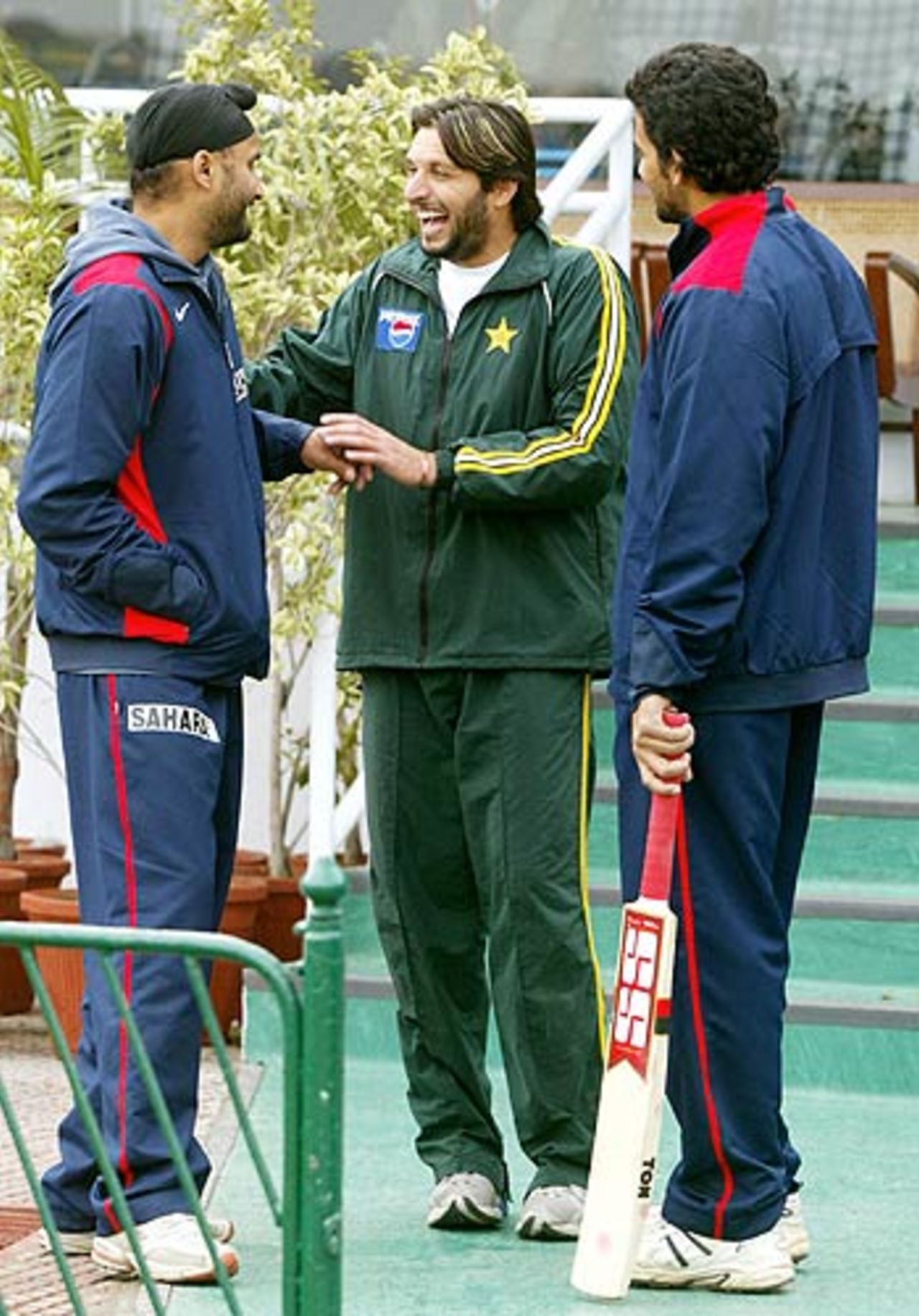After yesterday's massacre, Harbhajan Singh manages a wry smile with Shahid Afridi, India v Pakistan, 1st Test, Lahore, 3rd day, January 15, 2006