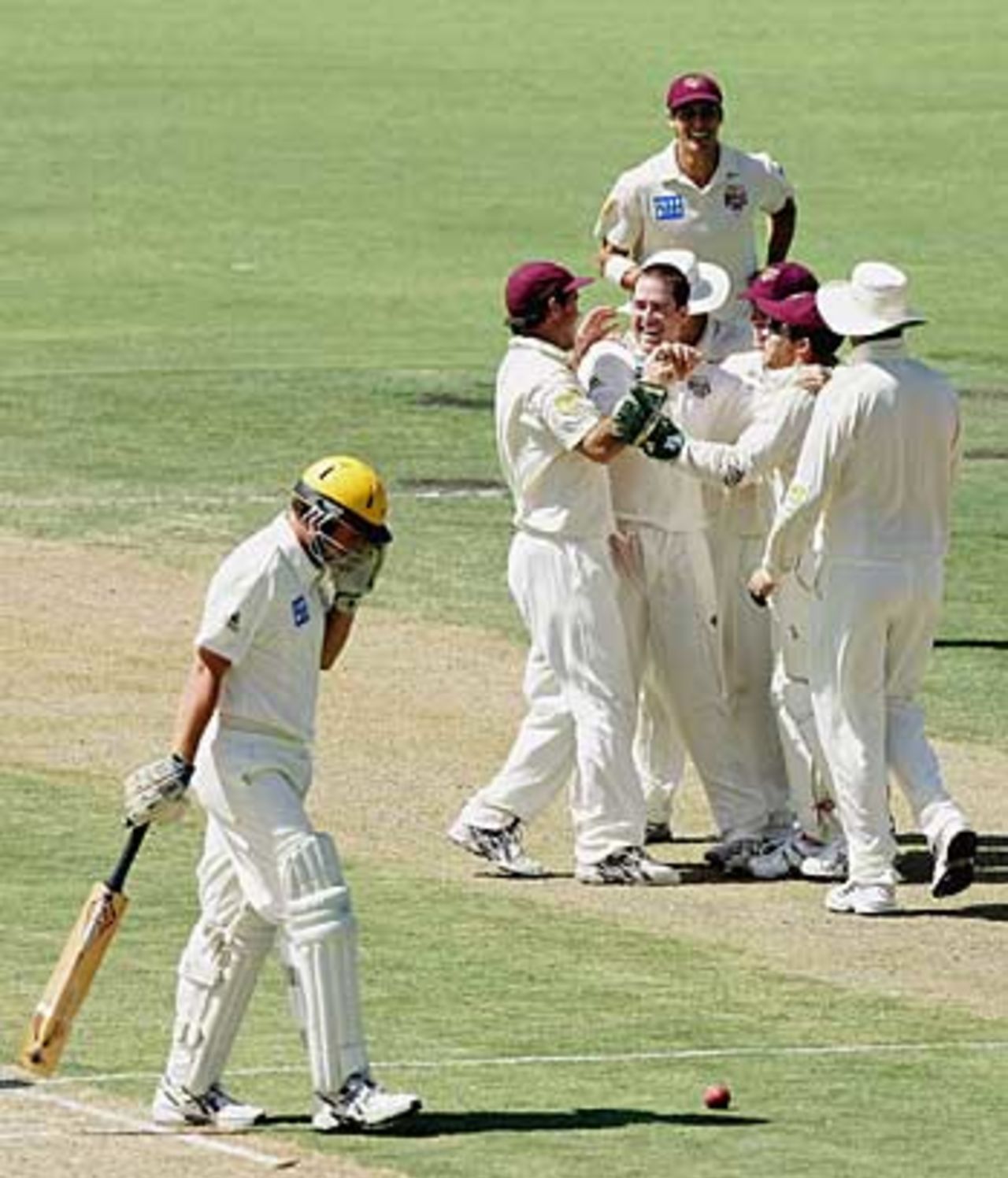 Daniel Doran is mobbed by his team-mates after dismissing Matthew Petrie, Western Australia v Queensland, Perth, Pura Cup, January 15, 2006