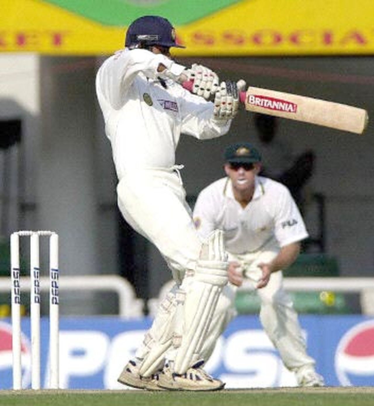 Indian opening batsman S. Ramesh (L) hits a ball to boundary during the first day's play of the first three-day cricket match against Australia in Nagpur, 17 February 2001. India were at 71 for 1 at the end of day's play in reply to Australia's 291.