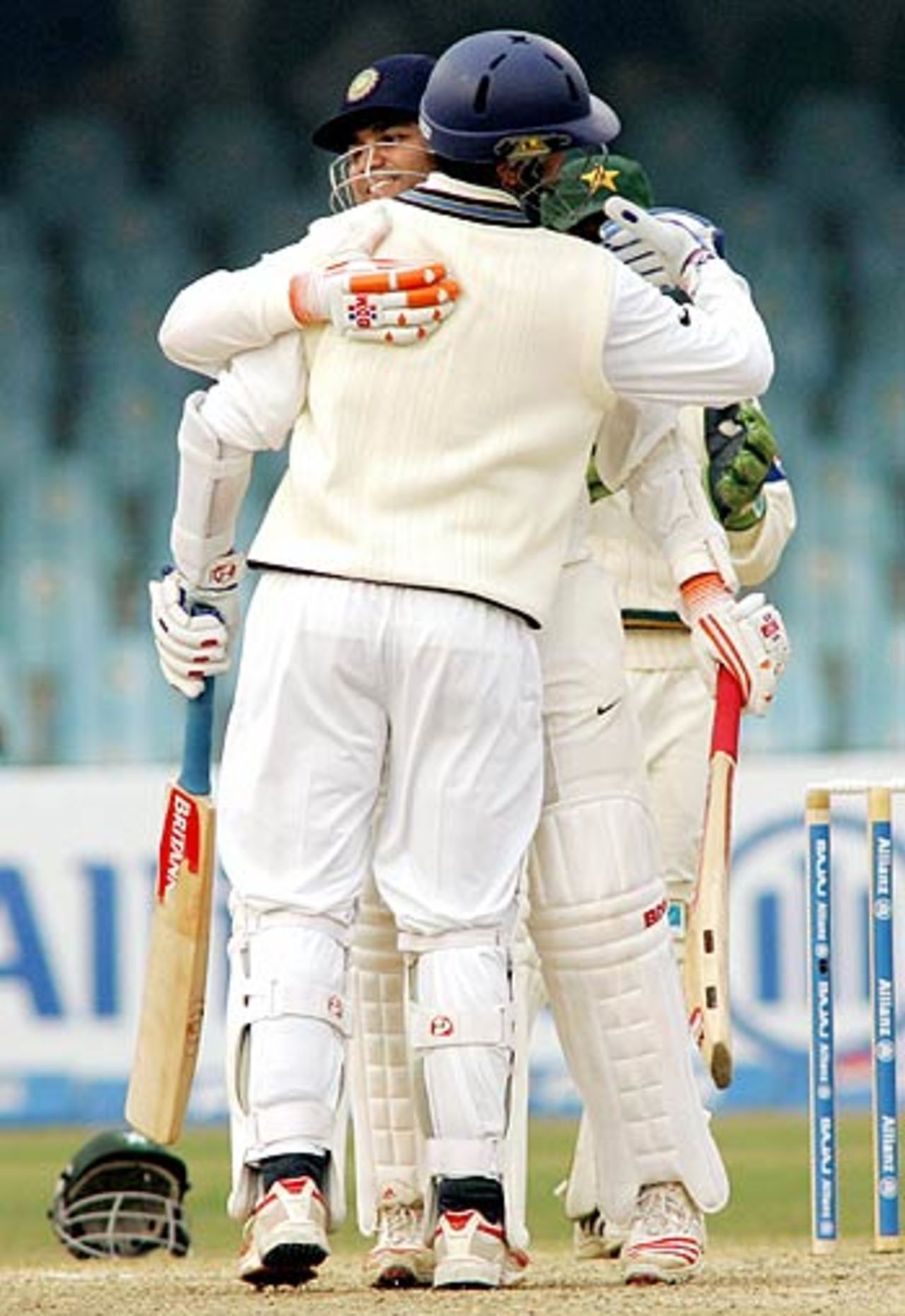 Virender Sehwag congratulates Rahul Dravid on his hundred, India in Pakistan, 1st Test, Lahore, January 16, 2006